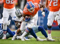 I Broncos RB JK Dobbins sono andati vicini a giocare nella partita del campionato AFC